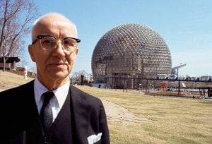 Buckminster Fuller standing in front of one of his domes