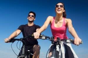 C60 FAQs and benefits - young couple on bicycle