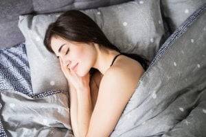 C60 Oil sleep benefits - young woman sleeping